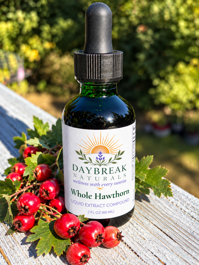 bottle of hawthorn tincture outside on a railing with berries